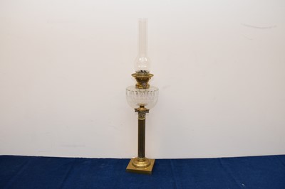 Lot 214 - A Victorian brass and glass oil lamp