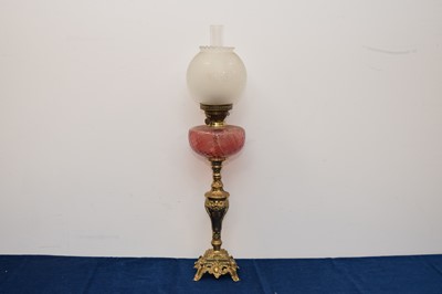 Lot 224 - An Edwardian period brass and glass oil table lamp