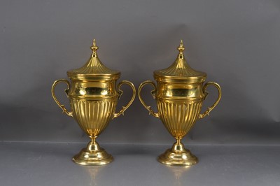 Lot 235 - A pair of gilt metal covered urns