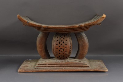 Lot 251 - An African carved wood stool