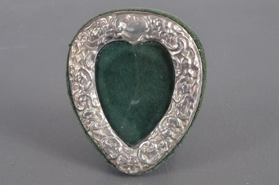 Lot 301 - A late 20th century silver heart shaped photograph frame