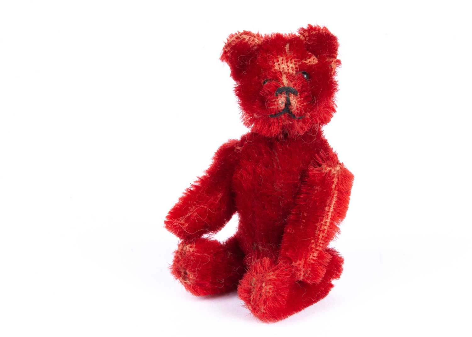 Lot 134 - A rare Schuco bright red mohair Teddy Bear, 1920s
