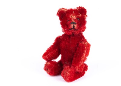 Lot 134 - A rare Schuco bright red mohair Teddy Bear, 1920s