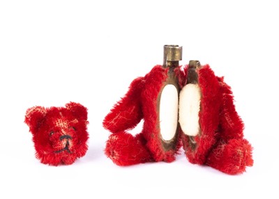 Lot 134 - A rare Schuco bright red mohair Teddy Bear, 1920s