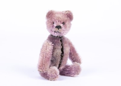 Lot 138 - A rare Schuco lilac mohair Teddy Bear manicure set, 1920s