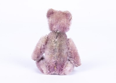 Lot 138 - A rare Schuco lilac mohair Teddy Bear manicure set, 1920s
