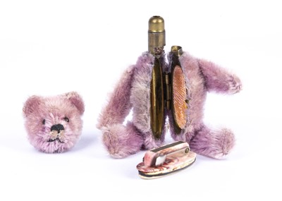 Lot 138 - A rare Schuco lilac mohair Teddy Bear manicure set, 1920s
