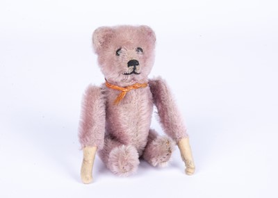 Lot 149 - A rare Schuco lilac mohair clockwork somersaulting Teddy Bear, 1930s