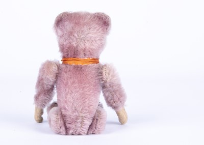 Lot 149 - A rare Schuco lilac mohair clockwork somersaulting Teddy Bear, 1930s