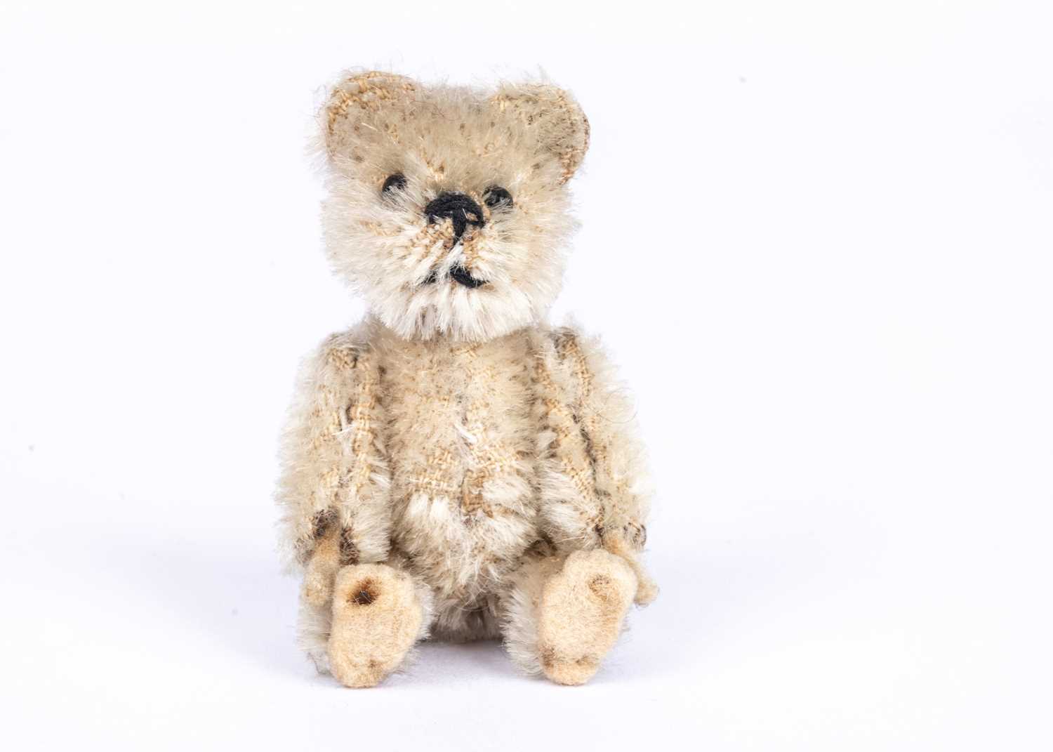 Lot 152 - A Schuco white mohair miniature Teddy Bear, 1930s