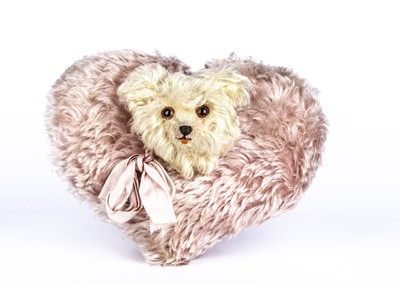 Lot 154 - A rare Jopi musical heart shaped cushion with Teddy Bear head, 1930s