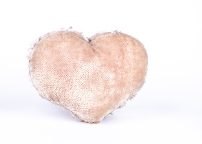 Lot 154 - A rare Jopi musical heart shaped cushion with Teddy Bear head, 1930s