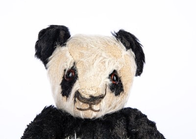 Lot 163 - A Merrythought panda Teddy Bear, 1939