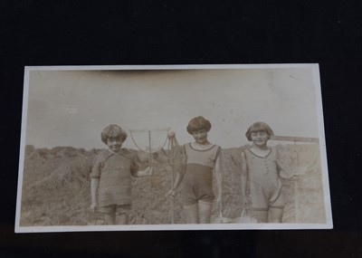 Lot 233 - Four original photographs of Christopher Robin and Anne Darlington at the beach
