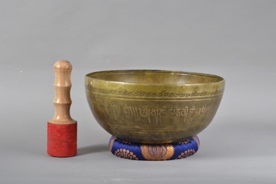 Lot 118 - A 20th century Far Eastern brass and inlaid singing bowl