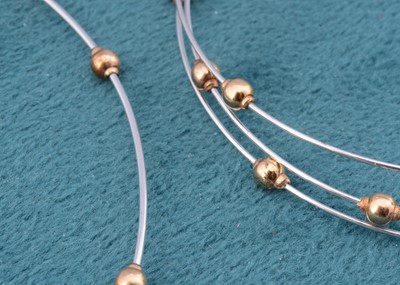 Lot 2 - A 9ct gold bi metal torque necklace