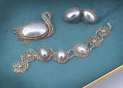 Lot 7 - A continental white metal filigree and osmera pearl suite