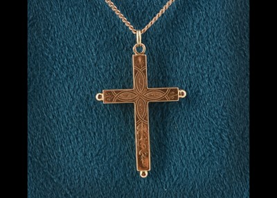 Lot 17 - A continental yellow metal engraved cross pendant