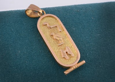 Lot 31 - An Egyptian yellow metal ingot pendant