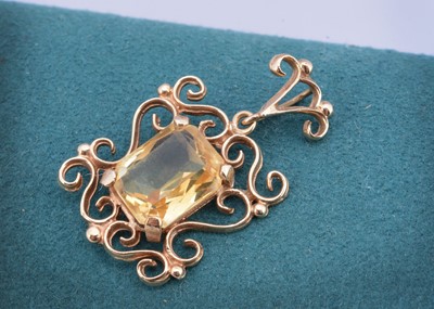 Lot 57 - A 9ct gold Citrine drop pendant of openwork design