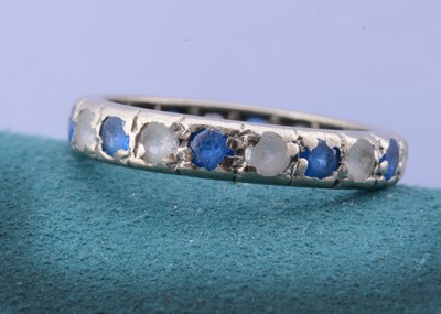 Lot 61 - A white 18ct gold sapphire and colourless paste eternity ring