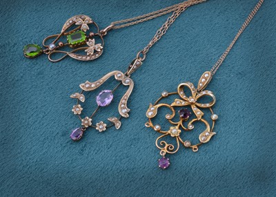 Lot 67 - Three Edwardian gem set seed pearl openwork pendants