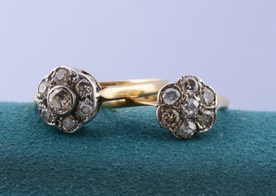 Lot 74 - Two 18ct gold and platinum set diamond set cluster dress rings