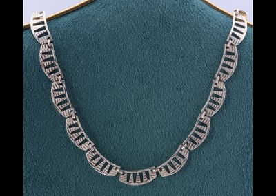 Lot 76 - A contemporary silver curved link necklace