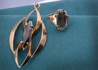 Lot 81 - A 9ct gold smoky quartz necklace and matching ring