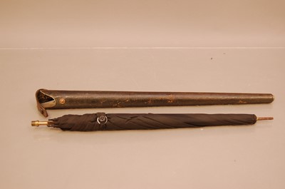 Lot 129 - An early 20th century umbrella, titled The Auto to inner of case, the leather case housing the black umbrella that screws into the case handle, lacks finial