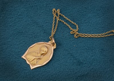 Lot 107 - A continental religious pendant of Virgin Mary on fine yellow metal chain bearing continental strike marks