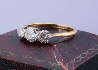 Lot 108 - An 18ct gold and platinum set three stone diamond ring