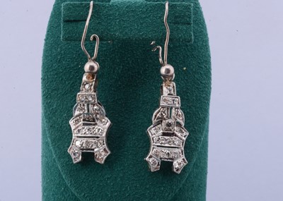 Lot 119 - A pair of platinum and diamond set ear drops