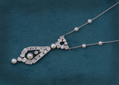 Lot 123 - A platinum and white gold art deco pendant on later chain