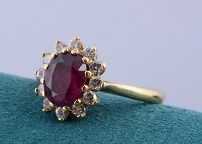 Lot 128 - An 18ct gold ruby and diamond cluster ring