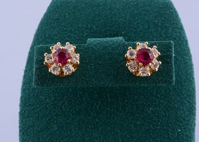 Lot 133 - A pair of 18ct gold ruby and diamond stud earrings