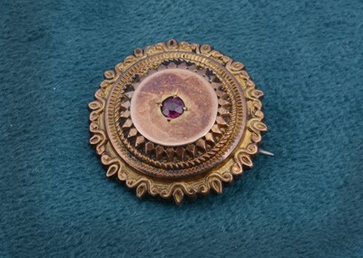 Lot 136 - A Victorian garnet target brooch with box back