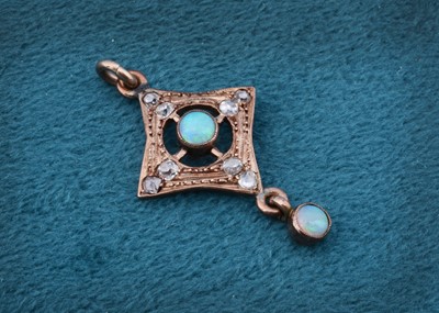 Lot 155 - An Edwardian silver and gold opal and diamond drop pendant