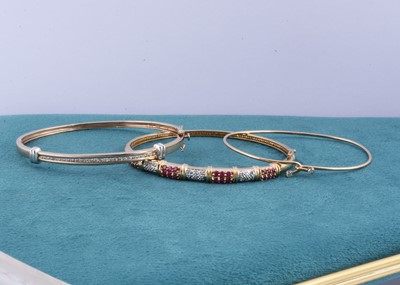 Lot 158 - Three gem set gold bangles