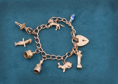 Lot 163 - A 9ct gold charm bracelet with a padlock heart clasp