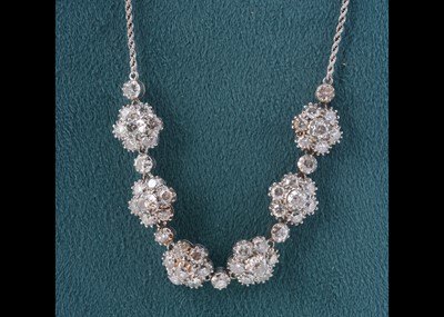 Lot 169 - A 9ct gold diamond seven cluster necklace