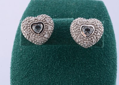 Lot 175 - A pair of 585 marked aquamarine and diamond heart shaped studs