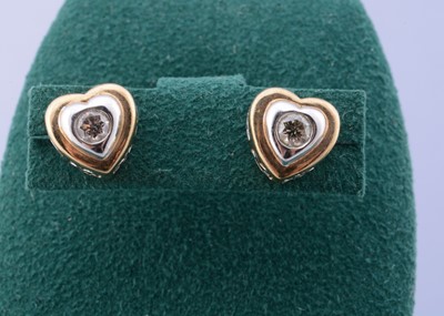 Lot 176 - A pair of 9ct gold diamond set ear studs