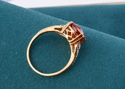 Lot 183 - An 18ct gold Lorique garnet and diamond set dress ring