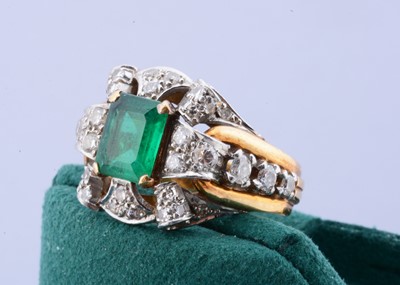 Lot 195 - A continental two colour gold emerald and diamond dress ring