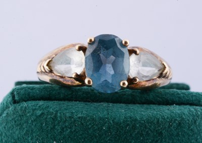 Lot 199 - A topaz 9ct gold three stone dress ring