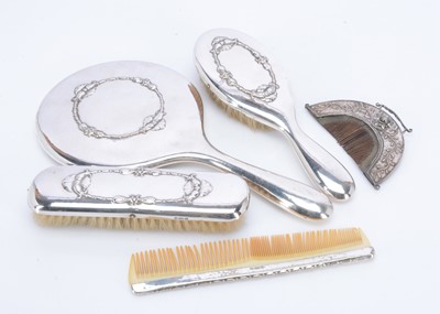 Lot 270 - A part four piece dressing table set and an interesting antique comb