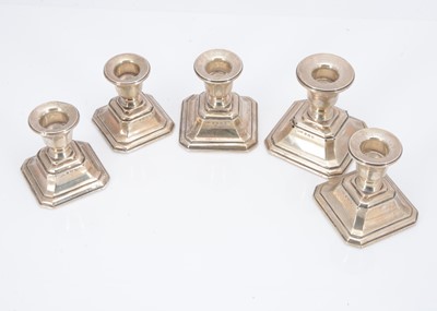 Lot 347 - A set of five George V silver filled dwarf candlesticks