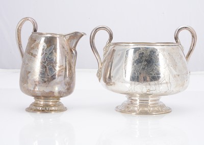 Lot 354 - An early 20th century Swedish milk jug and twin handled sugar basin