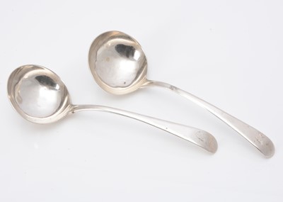 Lot 360 - A pair of George III silver sauce ladles by John Lampfert